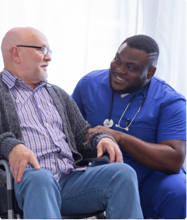 Male Assistant Helping Elderly Man
